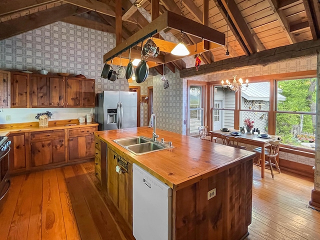 388 Hemlock Ridge Ln, Catawba, VA 24070 - kitchen with wood counters, appliances with stainless steel finishes, a sink, wallpapered walls, and light wood finished floors