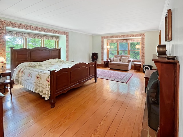 388 Hemlock Ridge Ln, Catawba, VA 24070 - bedroom with crown molding, multiple windows, and light wood finished floors