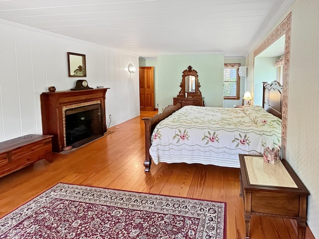 388 Hemlock Ridge Ln, Catawba, VA 24070 - bedroom featuring ornamental molding, wood finished floors, and a fireplace with flush hearth