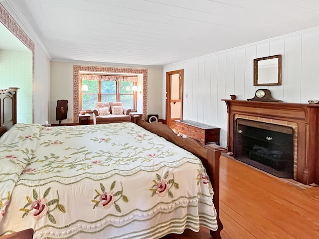 388 Hemlock Ridge Ln, Catawba, VA 24070 - bedroom featuring wood finished floors, ornamental molding, and a fireplace