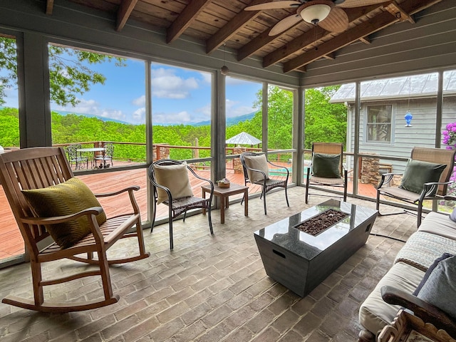 388 Hemlock Ridge Ln, Catawba, VA 24070 - sunroom featuring an outdoor fire pit, beamed ceiling, and ceiling fan