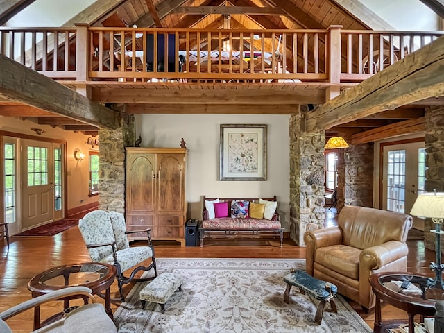 388 Hemlock Ridge Ln, Catawba, VA 24070 - living area featuring beamed ceiling, high vaulted ceiling, wood finished floors, healthy amount of natural light, and baseboards