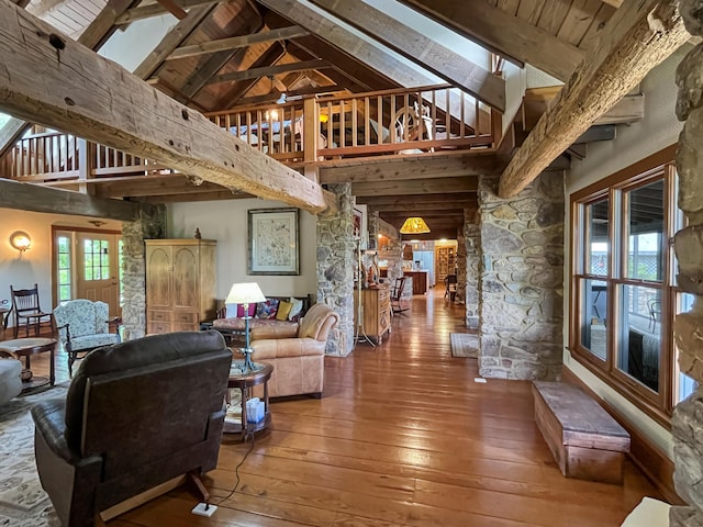 388 Hemlock Ridge Ln, Catawba, VA 24070 - living room featuring hardwood / wood-style flooring, beamed ceiling, high vaulted ceiling, and decorative columns