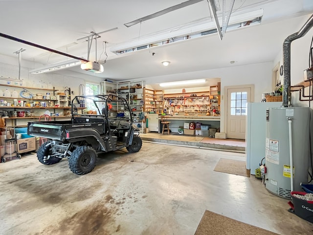 388 Hemlock Ridge Ln, Catawba, VA 24070 - garage with gas water heater, a workshop area, and a garage door opener