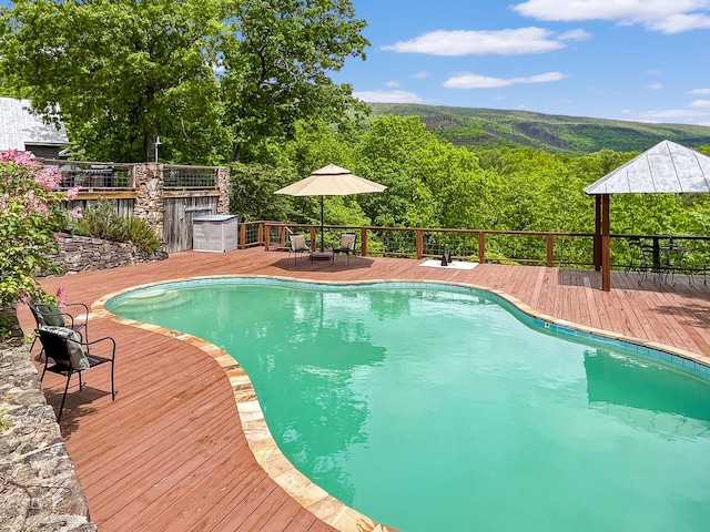 388 Hemlock Ridge Ln, Catawba, VA 24070 - view of pool with a wooden deck, outdoor dining area, and a forest view