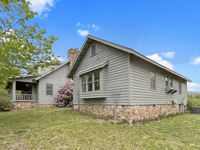 388 Hemlock Ridge Ln, Catawba, VA 24070 - view of home's exterior with a yard, a chimney, and cooling unit