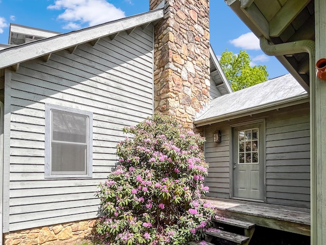 388 Hemlock Ridge Ln, Catawba, VA 24070 - view of home's exterior featuring a chimney and a wooden deck