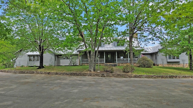 388 Hemlock Ridge Ln, Catawba, VA 24070 - view of front of home with a porch, a front yard, and metal roof