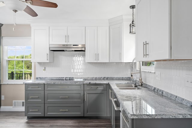 kitchen with gray cabinets, visible vents, a healthy amount of sunlight, under cabinet range hood, and electric stovetop