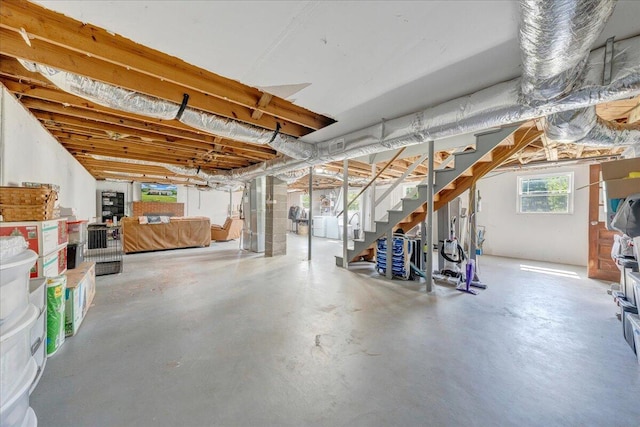 below grade area featuring stairway and washer and dryer