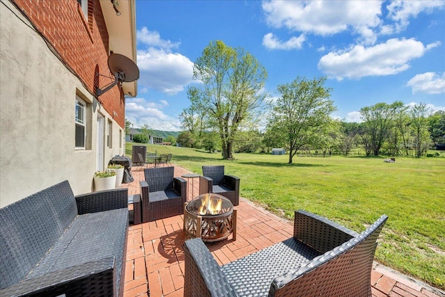 view of patio featuring a fire pit