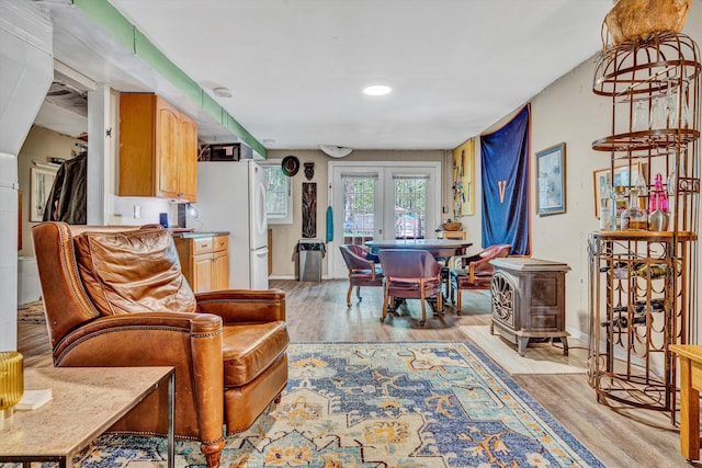1393 Deepwoods Rd, Hardy, VA 24101 - living area with light wood-style floors, french doors, and a wood stove