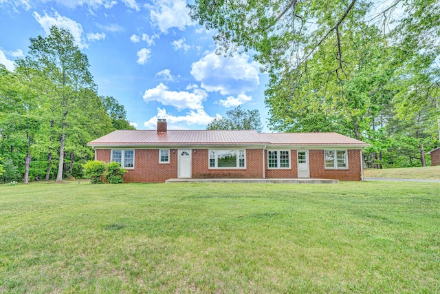 7080 Oak Level Rd, Bassett, VA 24055 - ranch-style house with metal roof, a chimney, a front lawn, and brick siding