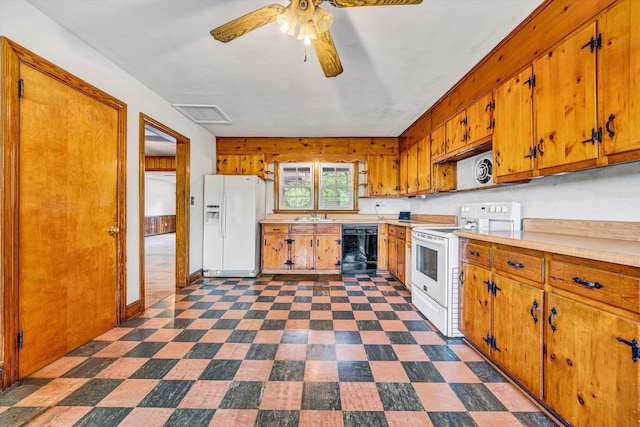 7080 Oak Level Rd, Bassett, VA 24055 - kitchen featuring ceiling fan, brown cabinetry, a sink, light countertops, and white appliances