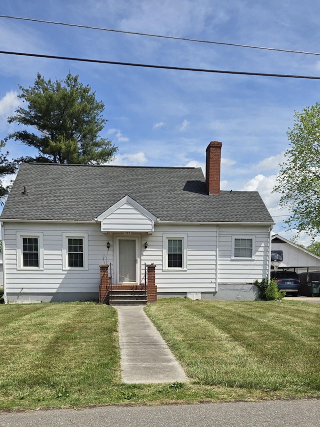 cape cod home featuring a chimney, roof with shingles, and a front lawn