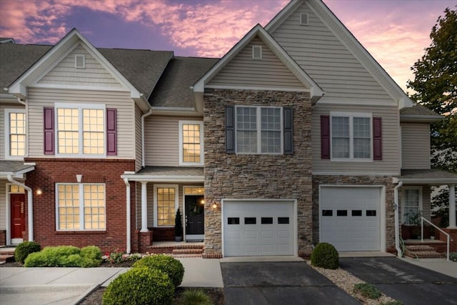 330 Sheliah Ct, Blacksburg, VA 24060 - view of front of house with stone siding, driveway, and an attached garage