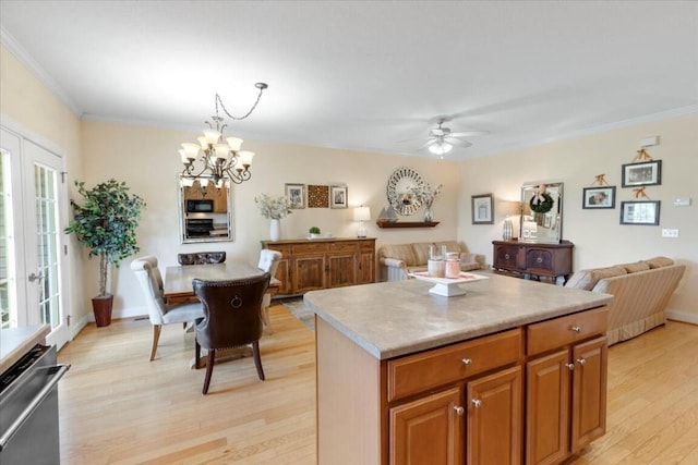 330 Sheliah Ct, Blacksburg, VA 24060 - kitchen featuring ornamental molding, black microwave, open floor plan, light wood-style floors, and light countertops