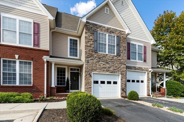 330 Sheliah Ct, Blacksburg, VA 24060 - view of front of home with stone siding, driveway, and a garage