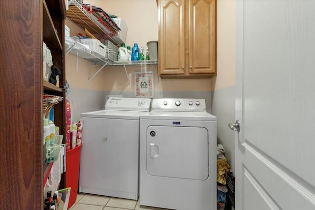 330 Sheliah Ct, Blacksburg, VA 24060 - laundry area featuring separate washer and dryer, cabinet space, and light tile patterned floors