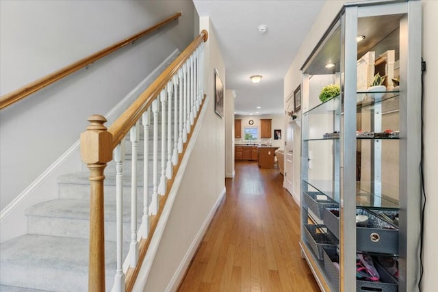 330 Sheliah Ct, Blacksburg, VA 24060 - hallway featuring baseboards, stairway, and light wood-type flooring