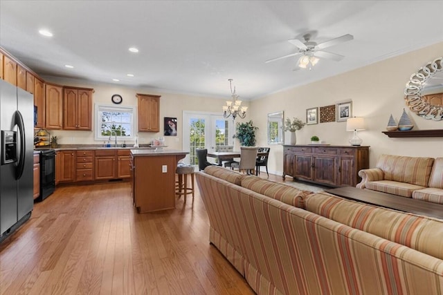 330 Sheliah Ct, Blacksburg, VA 24060 - living room with light wood finished floors, ceiling fan with notable chandelier, and recessed lighting