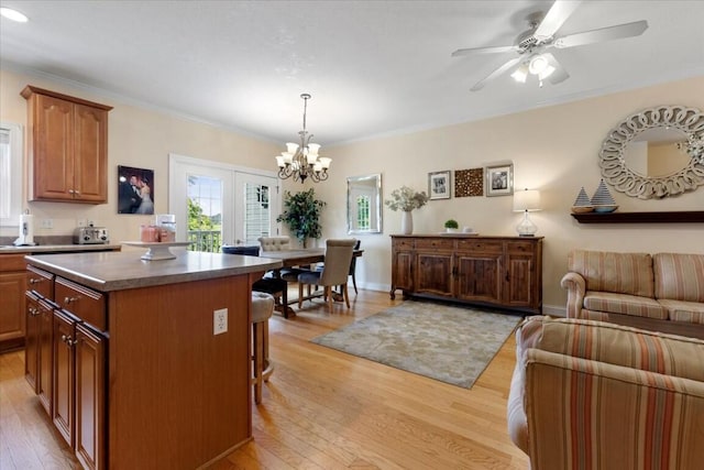 330 Sheliah Ct, Blacksburg, VA 24060 - kitchen with a center island, light wood-style flooring, a kitchen breakfast bar, open floor plan, and crown molding