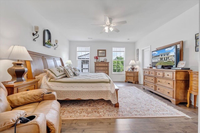bedroom with a ceiling fan and wood finished floors