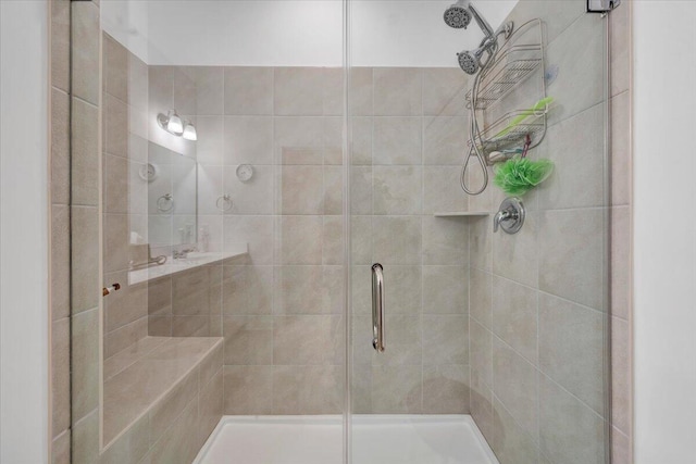 bathroom featuring a shower stall