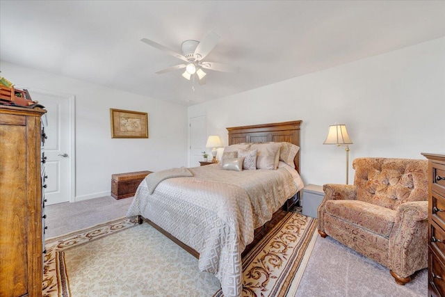 carpeted bedroom featuring a ceiling fan