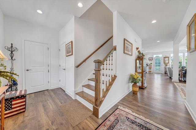 entrance foyer with stairs, recessed lighting, and wood finished floors