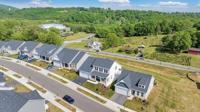 aerial view with a residential view and a wooded view