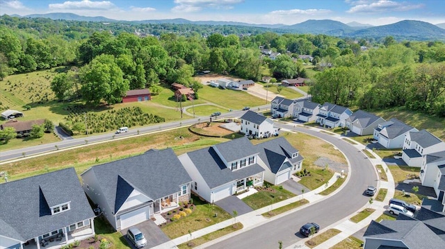 aerial view featuring a mountain view, a residential view, and a forest view