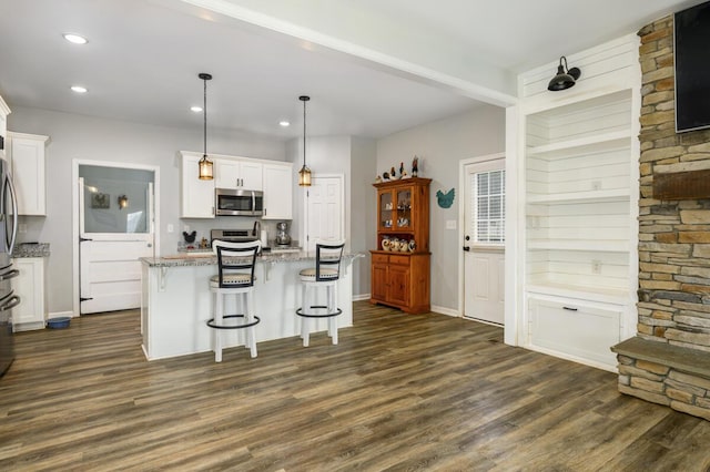 1169 Mountain Creek Ln, Big Island, VA 24526 - kitchen featuring appliances with stainless steel finishes, dark wood finished floors, white cabinets, light stone counters, and recessed lighting