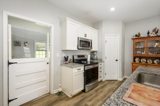 1169 Mountain Creek Ln, Big Island, VA 24526 - kitchen featuring stainless steel appliances, dark wood-type flooring, light stone counters, white cabinets, and recessed lighting