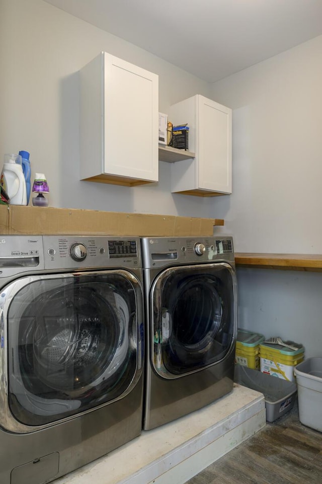 1169 Mountain Creek Ln, Big Island, VA 24526 - laundry area featuring washer and clothes dryer, cabinet space, and wood finished floors