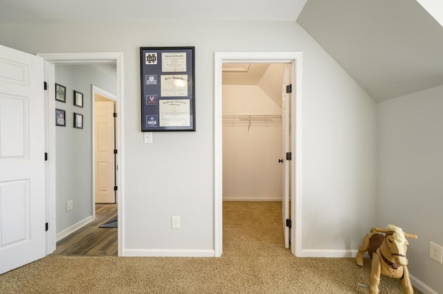 1169 Mountain Creek Ln, Big Island, VA 24526 - unfurnished bedroom featuring carpet flooring, vaulted ceiling, a spacious closet, baseboards, and a closet