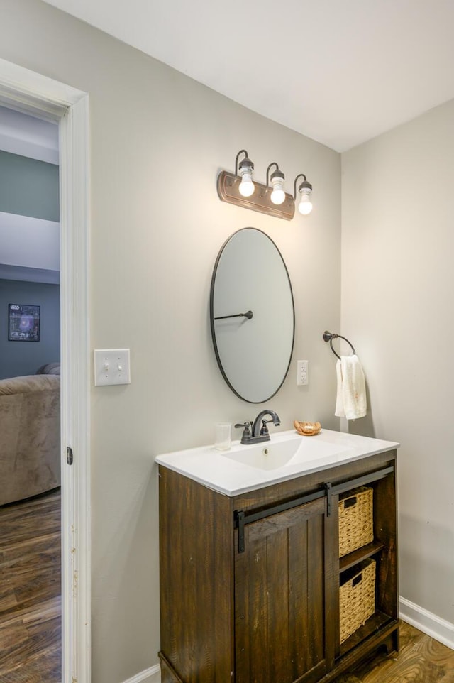1169 Mountain Creek Ln, Big Island, VA 24526 - bathroom featuring vanity, baseboards, and wood finished floors