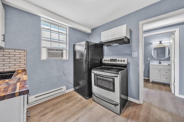 kitchen with electric range, a baseboard heating unit, ventilation hood, butcher block counters, and light wood finished floors