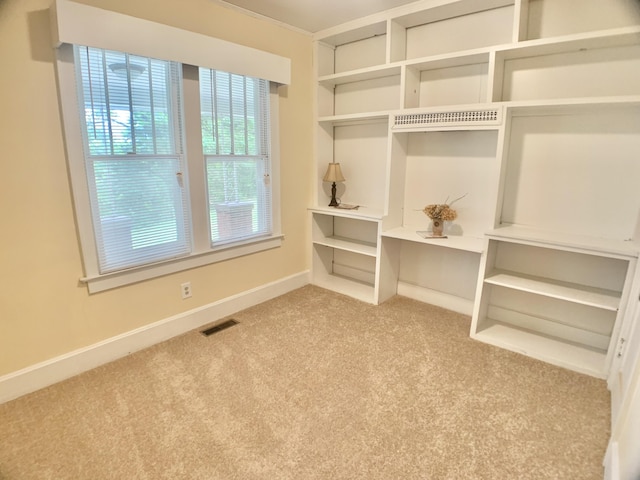 walk in closet featuring visible vents and carpet floors