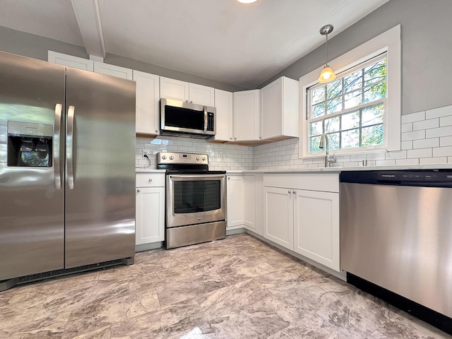 kitchen with stainless steel appliances, decorative backsplash, white cabinetry, light countertops, and beamed ceiling