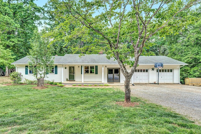 single story home with a porch, driveway, roof with shingles, a front lawn, and an attached garage