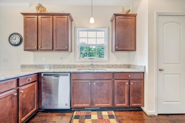 kitchen featuring dishwasher, light stone counters, hanging light fixtures, a sink, and dark wood-style floors