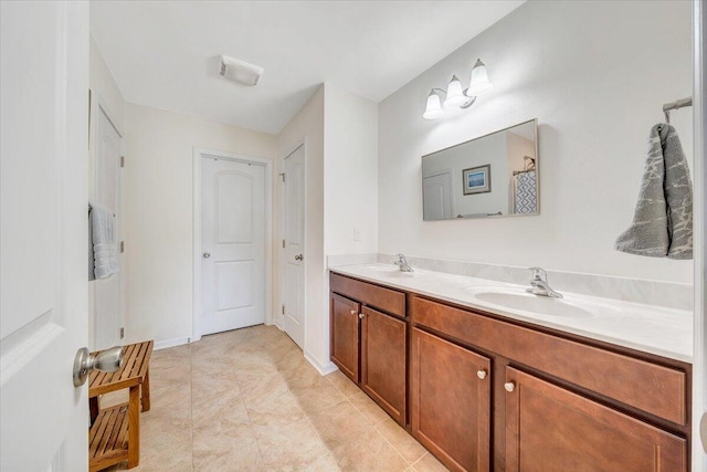 full bath with double vanity and a sink