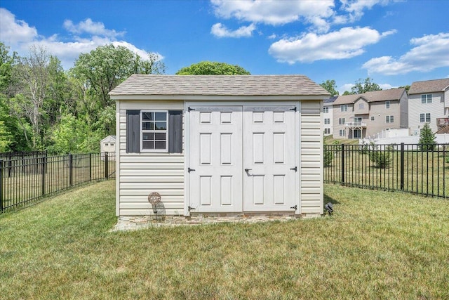 view of shed featuring a fenced backyard