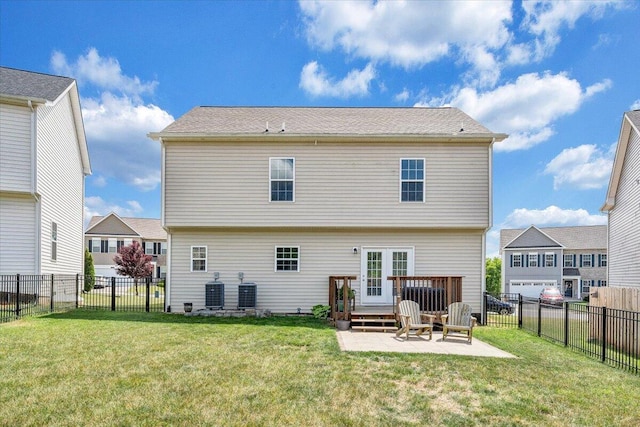 back of property with a yard, central AC unit, a fenced backyard, and a patio