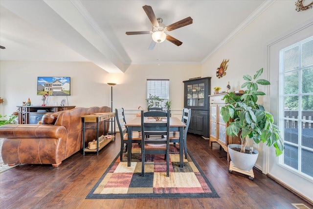 dining space with a ceiling fan, dark wood-style flooring, and ornamental molding