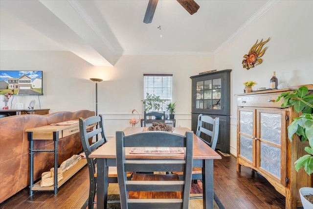 dining area featuring ornamental molding, a ceiling fan, and dark wood-type flooring
