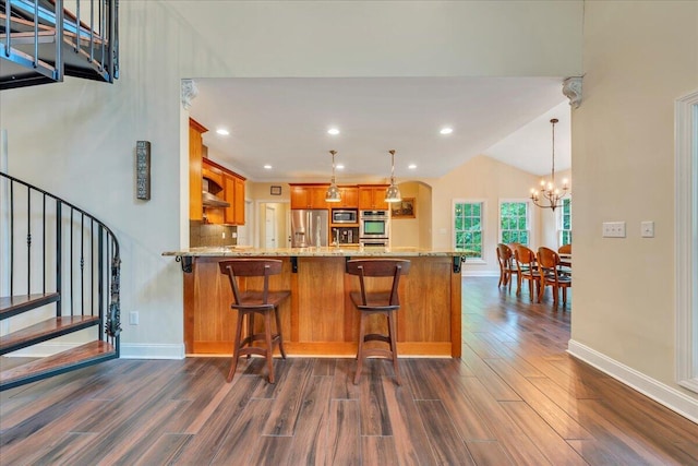kitchen featuring baseboards, stainless steel appliances, brown cabinets, and dark wood-style floors