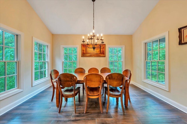 dining room featuring baseboards, a chandelier, and a healthy amount of sunlight
