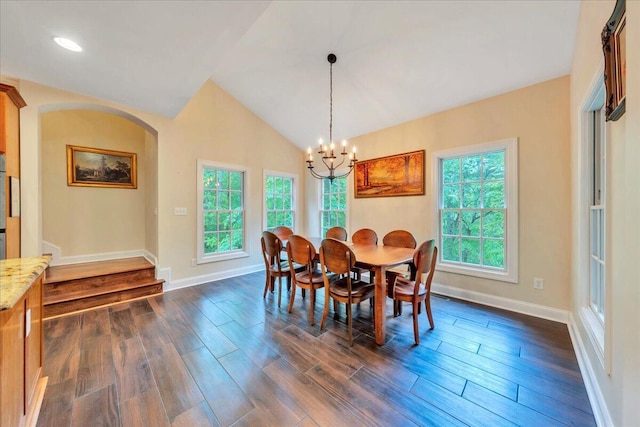 dining space featuring arched walkways, baseboards, an inviting chandelier, and dark wood-style floors